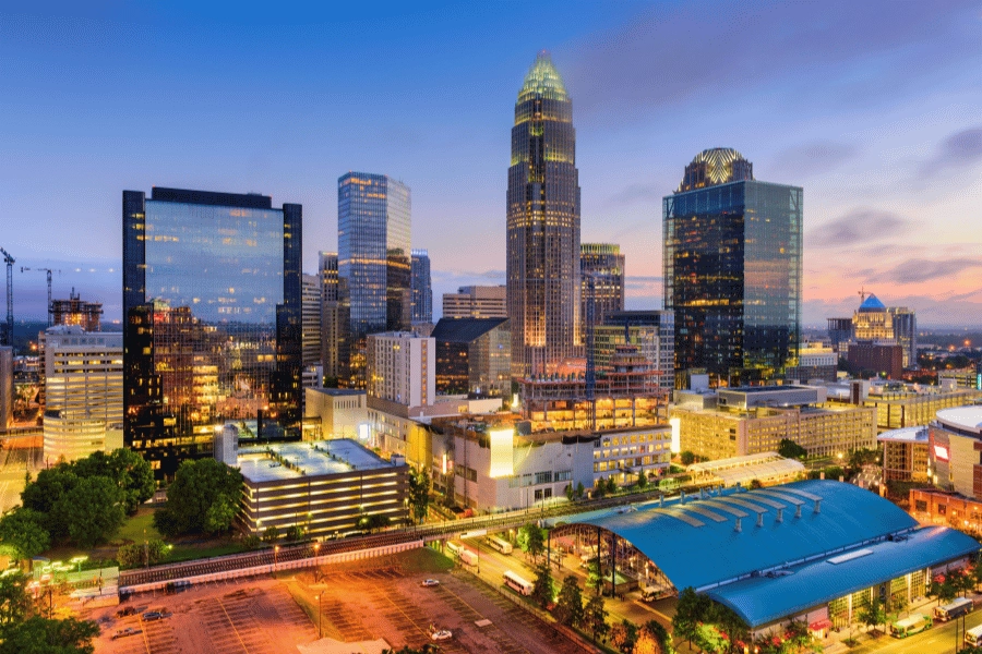 Charlotte, NC view of the city at dusk with all buildings lit up