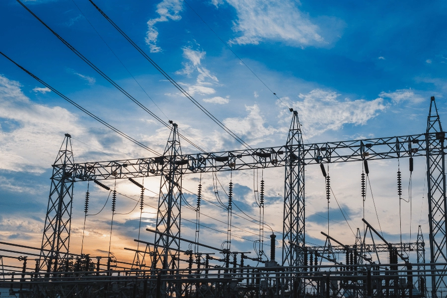 silhouette of substation towers during sunset 
