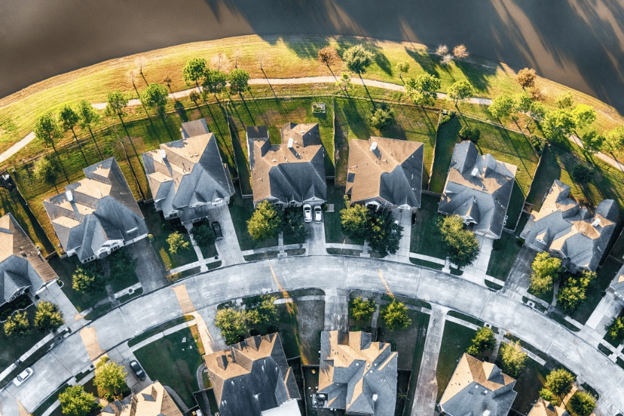 aerial view of suburban street with large homes