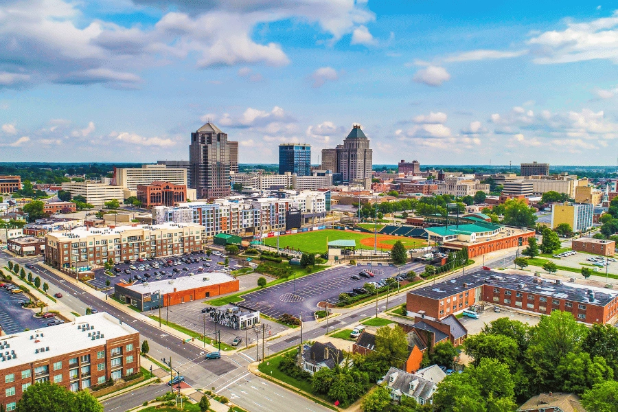 city view of Downtown Greensboro, NC overlooking buildings and baseball field