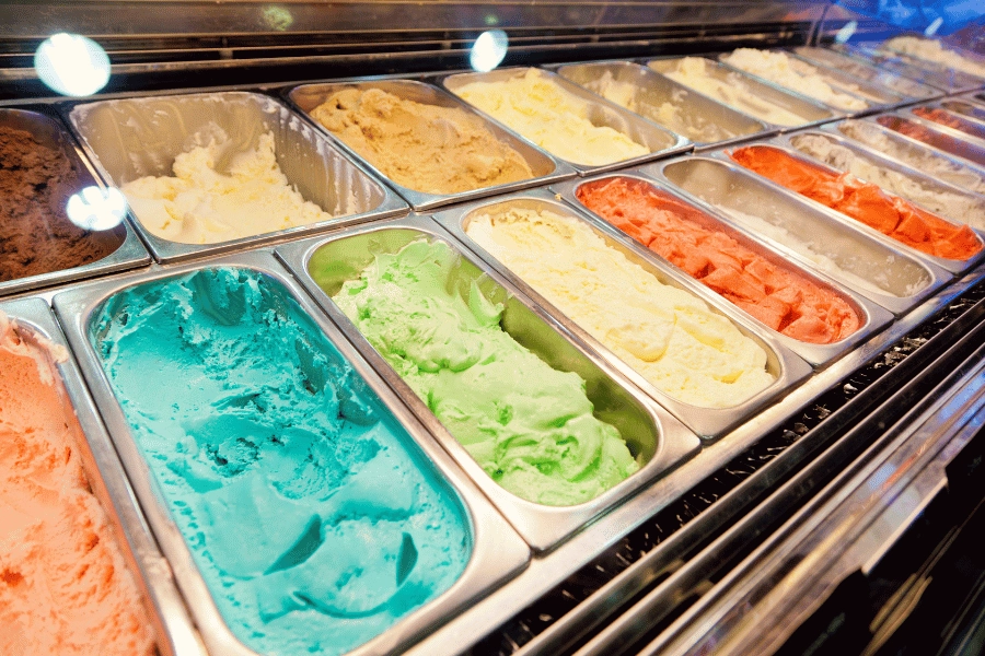 wide selection of ice cream flavors at an ice cream shop