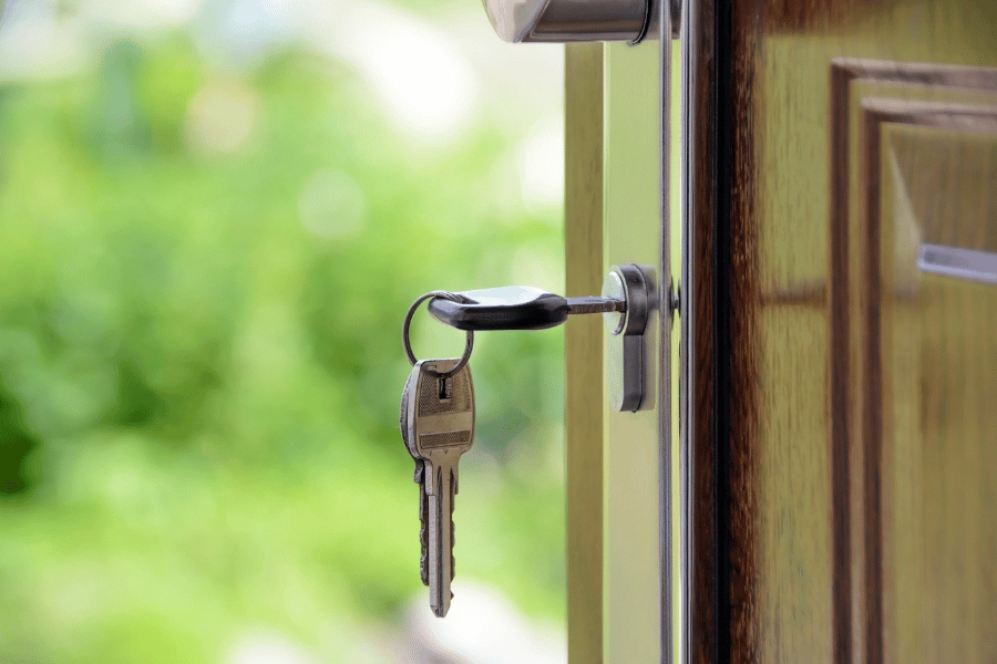 keys locking a front door at home 