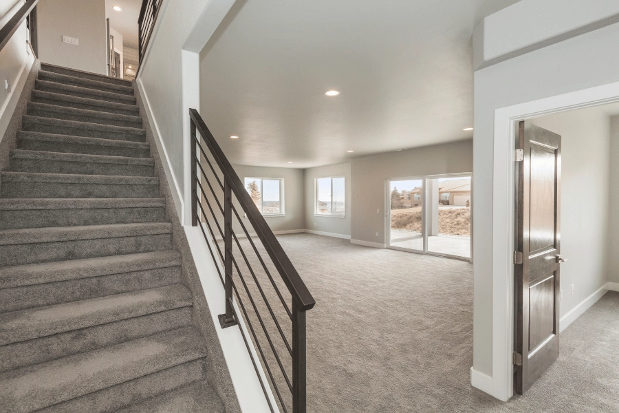 renovated and finished basement with nice carpeting 