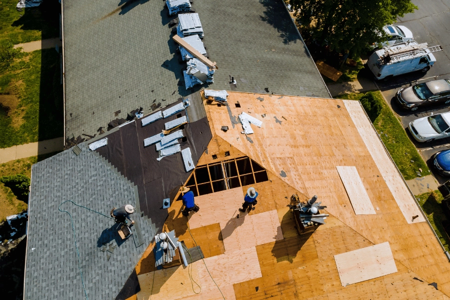 team working on a roof repair and replacement 