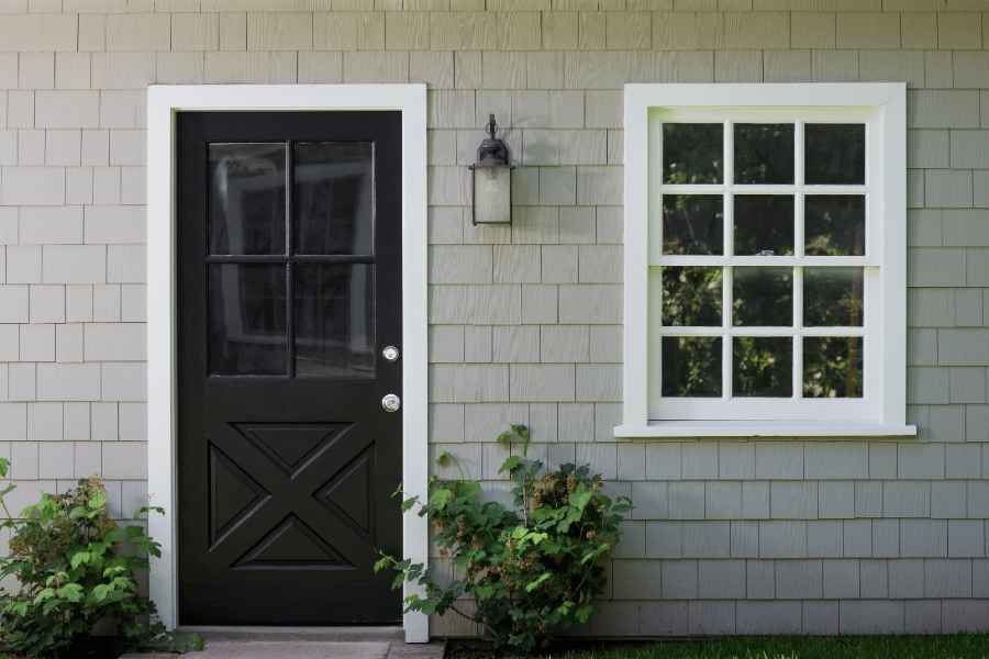 cute and welcoming guest house entrance with front door and window