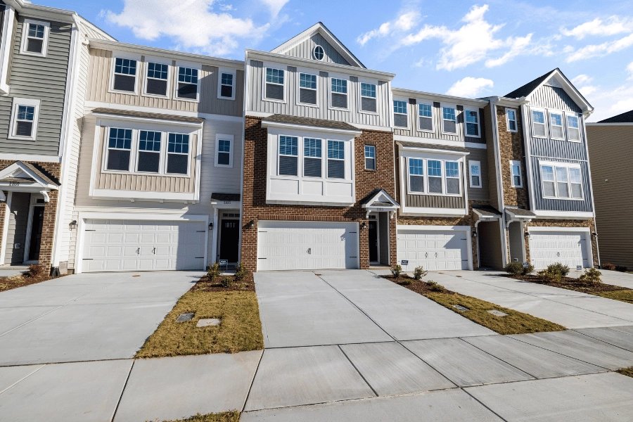 suburban townhomes with two-car garages and long driveways