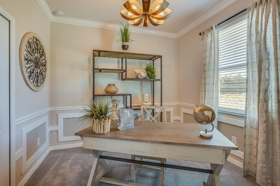 staged office in a home with a desk and unique decorations