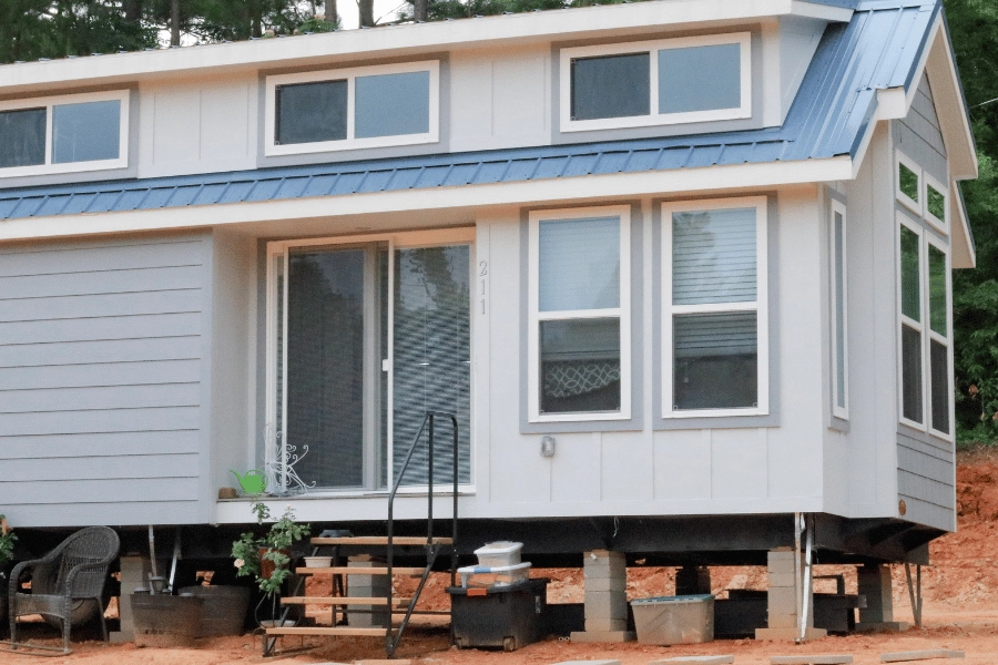mobile tiny home on wheels and cement blocks