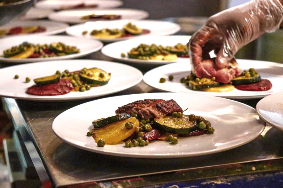chef plating dishes at a fine dining restaurant