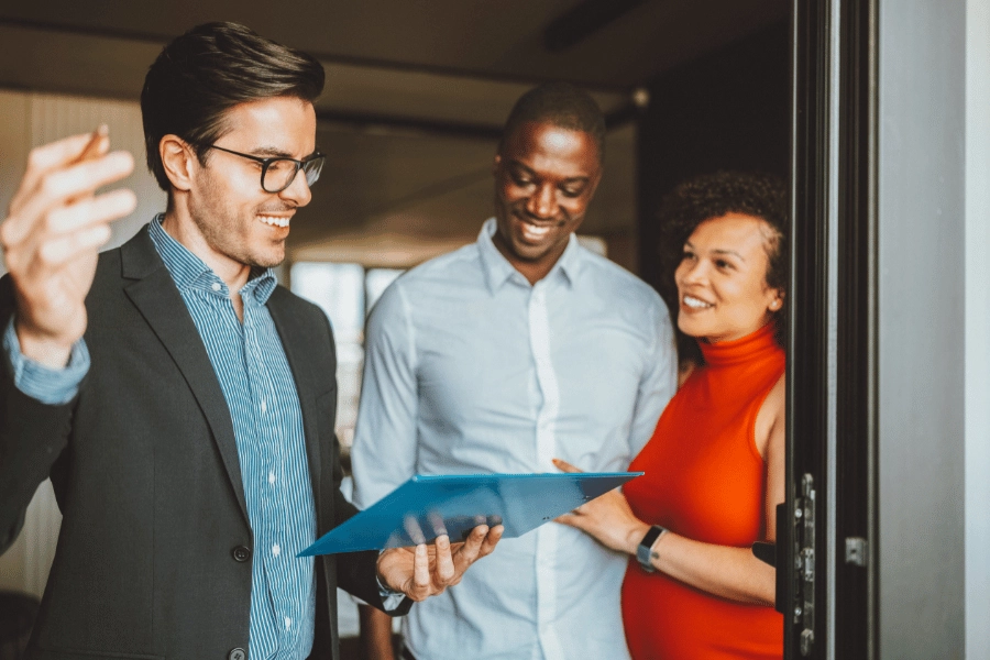 realtor talking to prospective buyers during an open house