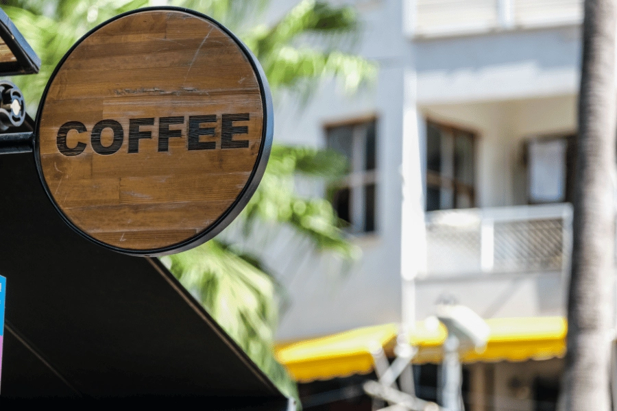 wooden coffee sign at a coffee shop