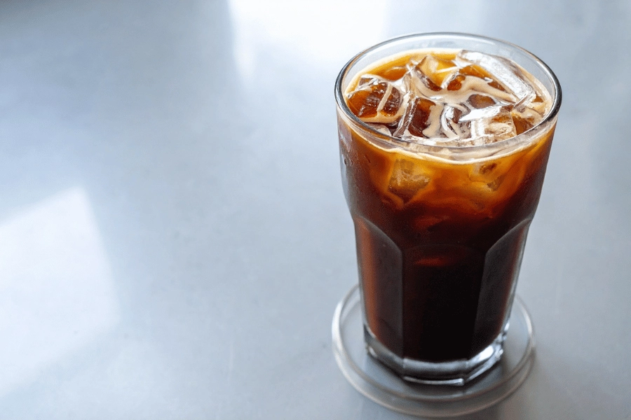 cold brew coffee with ice in a glass on a table 
