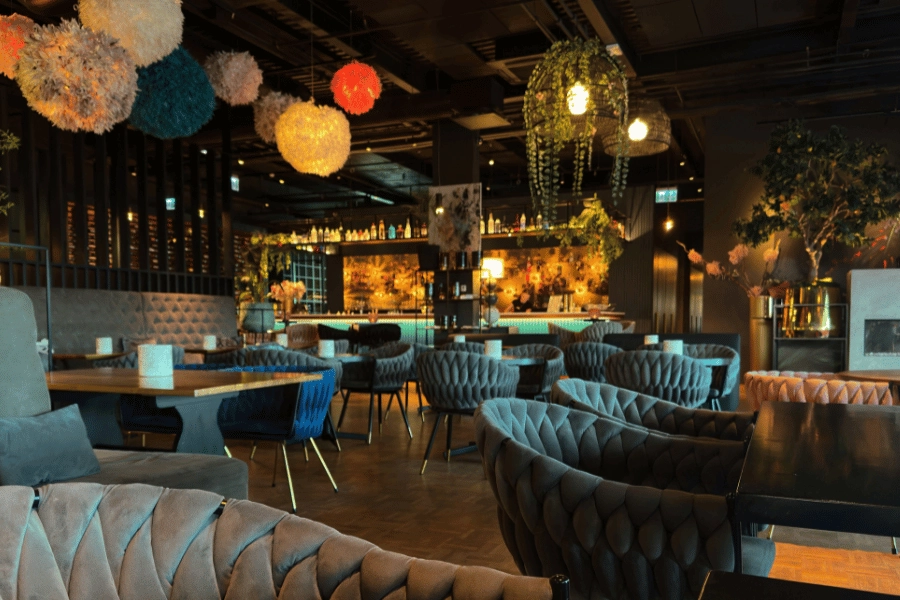 stylish restaurant with velvet chairs and unique interior decorations