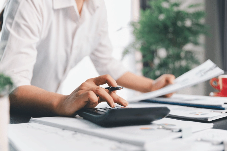 calculating taxes with a calculator during tax time